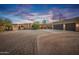 Stunning Southwestern-style home with a large driveway and three-car garage at 15339 E Red Bird Rd, Scottsdale, AZ 85262