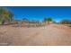 Round horse enclosure with rock wall and desert landscape at 15339 E Red Bird Rd, Scottsdale, AZ 85262