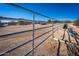 View of a horse stable with metal fencing and sandy ground at 15339 E Red Bird Rd, Scottsdale, AZ 85262