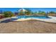 Sparkling pool and surrounding desert landscaping with patio furniture at 15339 E Red Bird Rd, Scottsdale, AZ 85262