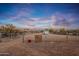 Large riding arena with a sand footing and horse trailer at 15339 E Red Bird Rd, Scottsdale, AZ 85262