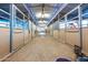 Long stable with multiple stalls and a center aisle at 15339 E Red Bird Rd, Scottsdale, AZ 85262