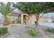 One-story house with a two-car garage and desert landscaping at 37307 W Oliveto Ave, Maricopa, AZ 85138