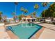 Community pool with lounge chairs and a clubhouse in background at 6138 N 28Th St, Phoenix, AZ 85016