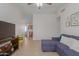 Living room featuring a sectional sofa and a view of the kitchen at 6518 W Sonora St, Phoenix, AZ 85043