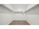 Large walk-in closet with double hanging rods and shelving at 9911 S Caballo Dr, Apache Junction, AZ 85120