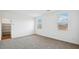 Spacious bedroom with neutral carpeting and ample closet space at 9911 S Caballo Dr, Apache Junction, AZ 85120