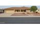 Single-story home with a landscaped yard and attached garage at 9412 W Briarwood Cir, Sun City, AZ 85351