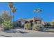 Tan stucco house with covered entry and desert landscaping at 11165 E Gold Dust Ave, Scottsdale, AZ 85259