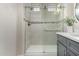 Modern bathroom with tiled shower, gray vanity, and brushed nickel fixtures at 1406 W Main St # 137, Mesa, AZ 85201