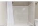 Simple bathroom with a white shower/tub combo and shower curtain at 1406 W Main St # 137, Mesa, AZ 85201