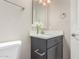 Bathroom features a dark gray vanity, white countertop, and modern fixtures at 1406 W Main St # 137, Mesa, AZ 85201