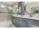 Modern bathroom with dual vanities, a walk-in shower, and updated fixtures at 1406 W Main St # 137, Mesa, AZ 85201