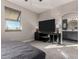 Bedroom featuring carpeted floors, a large bed, and a TV at 1406 W Main St # 137, Mesa, AZ 85201
