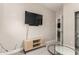 Cozy bedroom with a TV, entertainment center, and a small sitting area at 1406 W Main St # 137, Mesa, AZ 85201