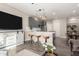 Modern kitchen with gray cabinetry, white countertops, and an island with bar seating at 1406 W Main St # 137, Mesa, AZ 85201
