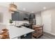 Updated kitchen with gray shaker cabinets, white quartz counters, stainless steel appliances, and a butcher block island at 1406 W Main St # 137, Mesa, AZ 85201