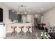 Sleek kitchen with stainless steel appliances, dark gray cabinets, and white countertops at 1406 W Main St # 137, Mesa, AZ 85201
