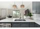 Kitchen with island, sink, and stainless steel faucet at 1406 W Main St # 137, Mesa, AZ 85201
