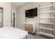 Office space featuring a marble-top table, a wooden cabinet, and wall shelving at 1406 W Main St # 137, Mesa, AZ 85201