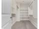 Spacious walk-in closet with built-in shelves and ample storage space at 1406 W Main St # 137, Mesa, AZ 85201