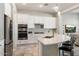 Modern kitchen with white cabinets and stainless steel appliances at 16944 W Coronado Rd, Goodyear, AZ 85395