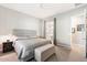 Bright bedroom with king-size bed and access to en-suite bathroom at 16944 W Coronado Rd, Goodyear, AZ 85395