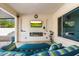 Covered patio with comfortable seating and a fireplace at 16944 W Coronado Rd, Goodyear, AZ 85395