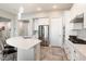 Modern kitchen with white cabinets and a large island at 16944 W Coronado Rd, Goodyear, AZ 85395