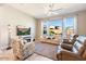 Relaxing living room with large windows and comfortable seating at 16944 W Coronado Rd, Goodyear, AZ 85395