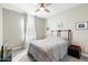 Charming bedroom with queen-size bed and window with natural light at 16944 W Coronado Rd, Goodyear, AZ 85395