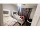 Well-lit bedroom with twin beds and neutral color palette at 9618 N 66 Dr, Glendale, AZ 85302