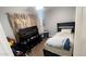 Bright bedroom with twin bed, TV, and ample closet space at 9618 N 66 Dr, Glendale, AZ 85302