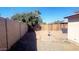 Small backyard with block wall and wooden fence at 9618 N 66 Dr, Glendale, AZ 85302