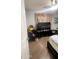 Bright bedroom with large bed, TV, and ample floor space at 9618 N 66 Dr, Glendale, AZ 85302