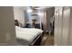 Bedroom with a queen bed, dresser, and additional space at 9618 N 66 Dr, Glendale, AZ 85302