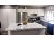 Island kitchen with stainless steel appliances and white cabinets at 9618 N 66 Dr, Glendale, AZ 85302
