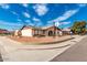 Ranch-style home with landscaped front yard and solar panels at 9618 N 66 Dr, Glendale, AZ 85302