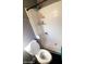 Updated bathroom with shower/tub combo, toilet, and shelves at 9618 N 66 Dr, Glendale, AZ 85302
