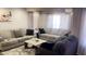 Spacious living room with comfortable seating and large windows at 9618 N 66 Dr, Glendale, AZ 85302