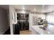 Kitchen features stainless steel appliances and laundry in unit at 9618 N 66 Dr, Glendale, AZ 85302