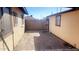 Small side yard with paved area and small wall at 9618 N 66 Dr, Glendale, AZ 85302