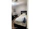 Cozy bedroom featuring a twin-size bed and a small side table at 9618 N 66 Dr, Glendale, AZ 85302