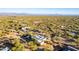 Aerial view of a desert property with a house and surrounding desert landscape at 14129 E Barbie Ln, Scottsdale, AZ 85262