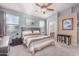 Spacious primary bedroom with carpeted floor, neutral wall paint, and ensuite bathroom access at 18478 N Canal Dr, Surprise, AZ 85374