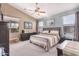 Spacious main bedroom with a king-size bed and plenty of natural light at 18478 N Canal Dr, Surprise, AZ 85374