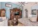 Spacious living room with built-in shelving and fireplace at 18478 N Canal Dr, Surprise, AZ 85374