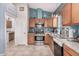 Kitchen with granite countertops, stainless steel appliances, and wood cabinetry at 18478 N Canal Dr, Surprise, AZ 85374