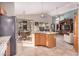 Island kitchen with granite countertops and stainless steel appliances at 18478 N Canal Dr, Surprise, AZ 85374