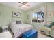 Guest bedroom with window seat, light green walls and plenty of natural light at 18478 N Canal Dr, Surprise, AZ 85374
